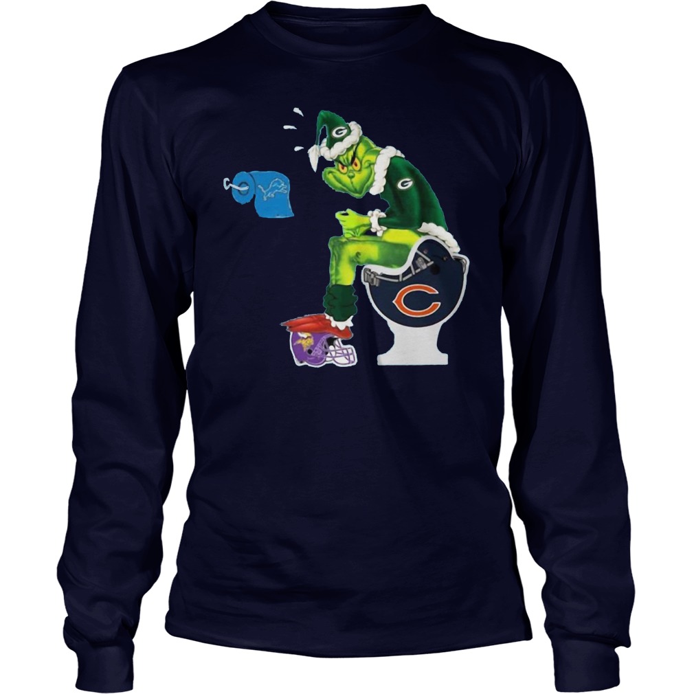 Green bay packers grinch sitting on chicago bears toilet and step on  minnesota vikings helmet with detroit lions paper shirt, hoodie, longsleeve  tee, sweater